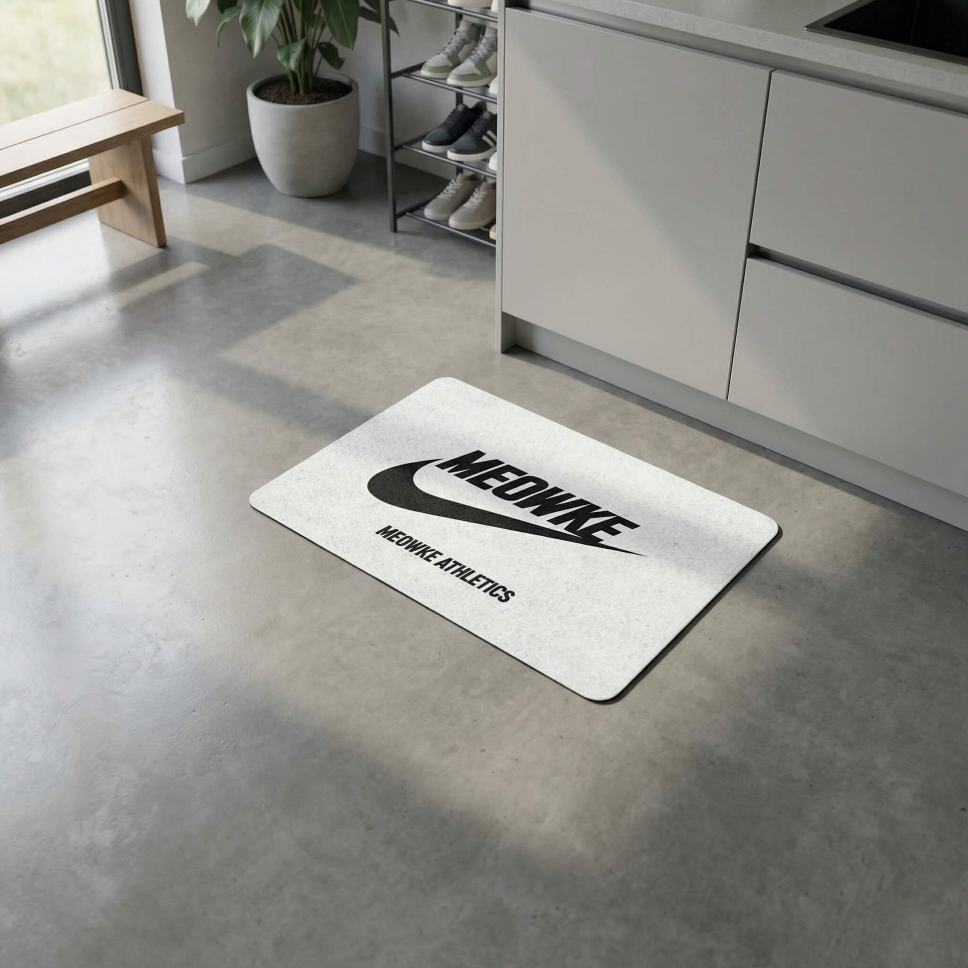 White Meowke cat bowl mat with sporty branding in a minimalist home setting