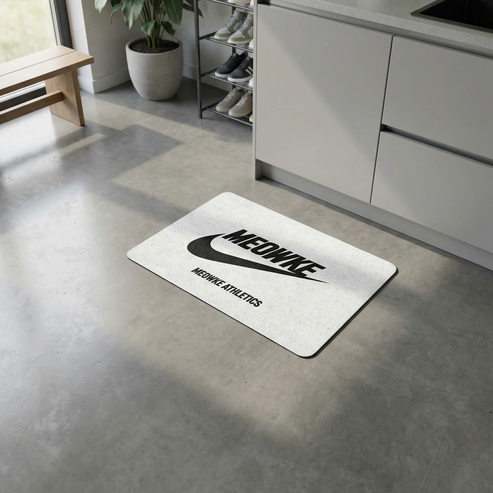 White Meowke cat bowl mat with sporty branding in a minimalist home setting