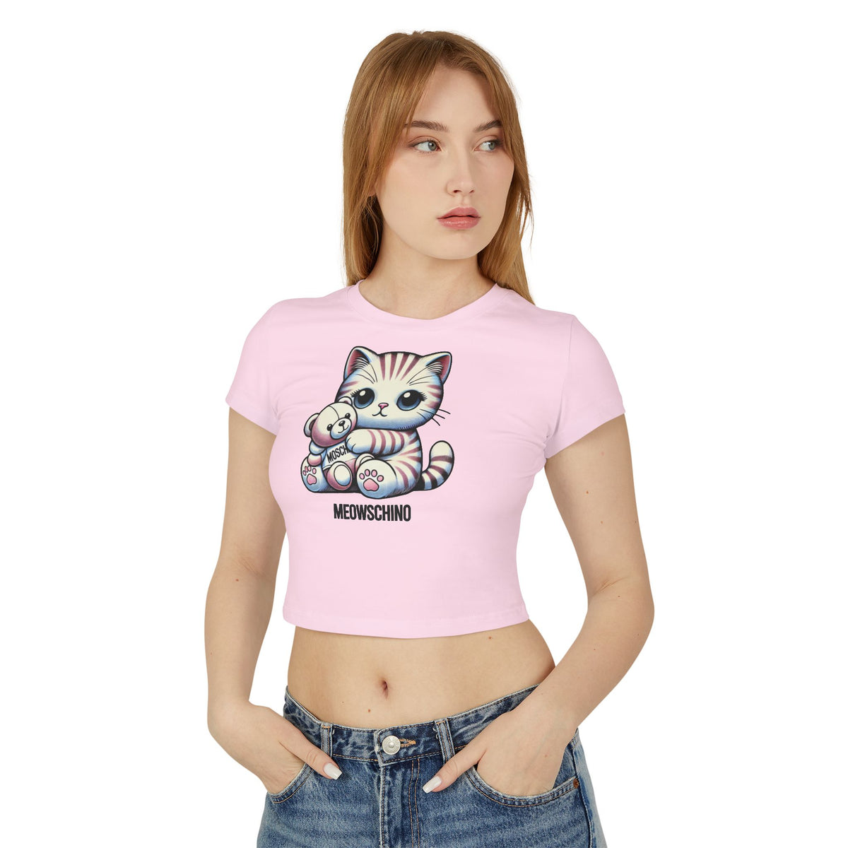 Meowschino Teddy Hug Cat Graphic Women's Baby Tee in light pink, worn by a female model