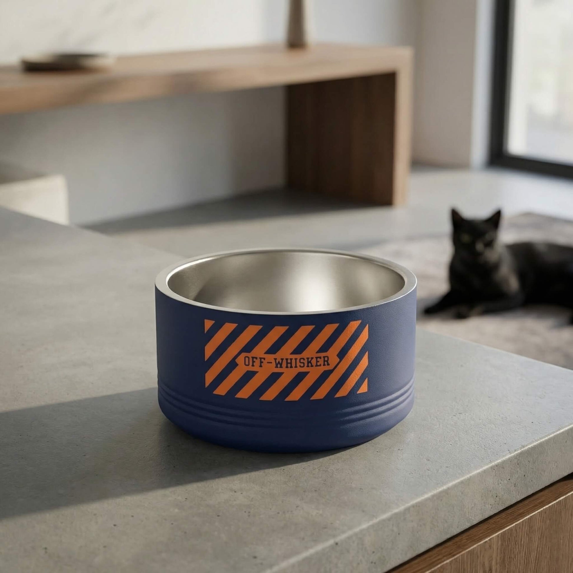 Navy blue stainless steel cat bowl with front logo in modern home