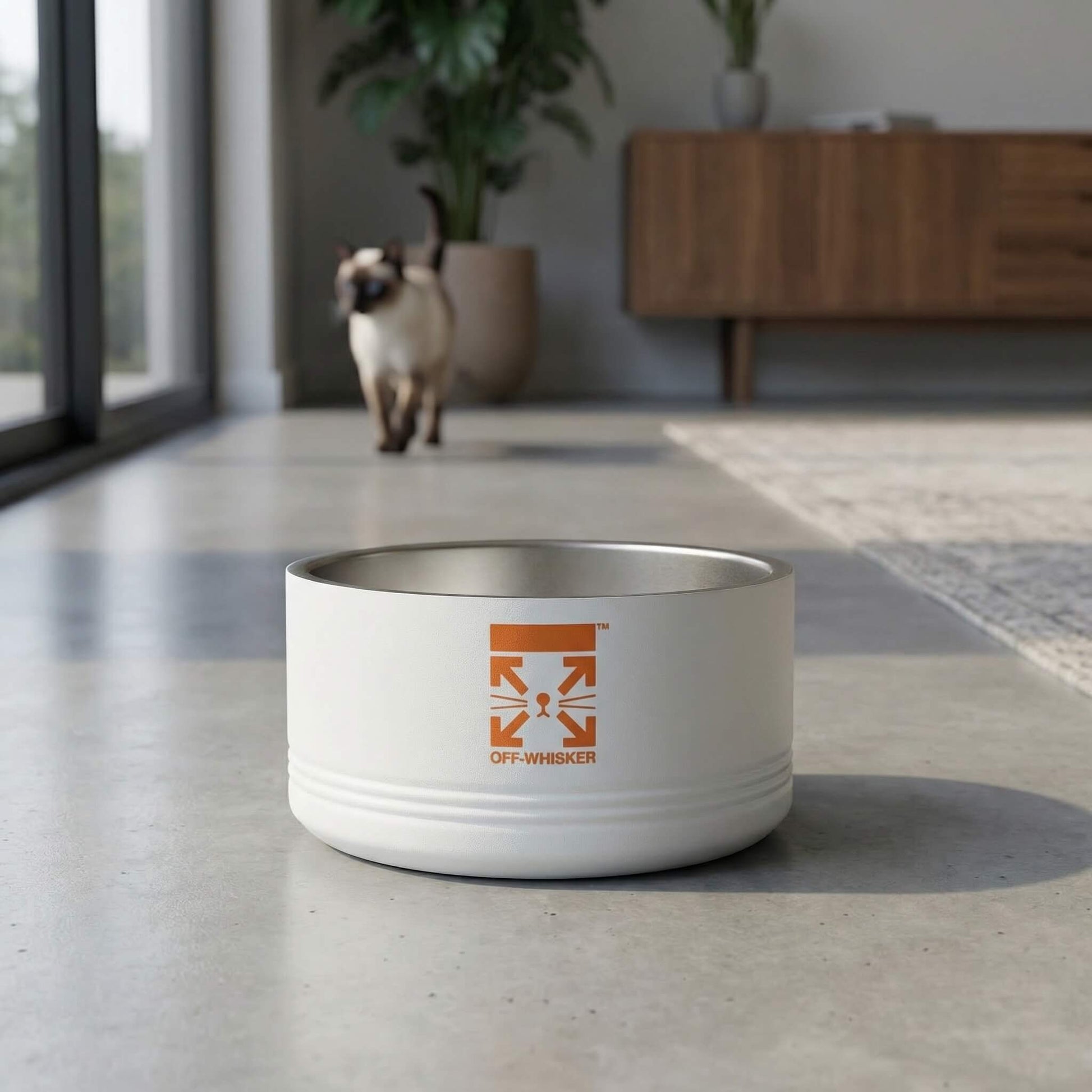 Designer white stainless steel cat bowl with Off Whisker front logo in home