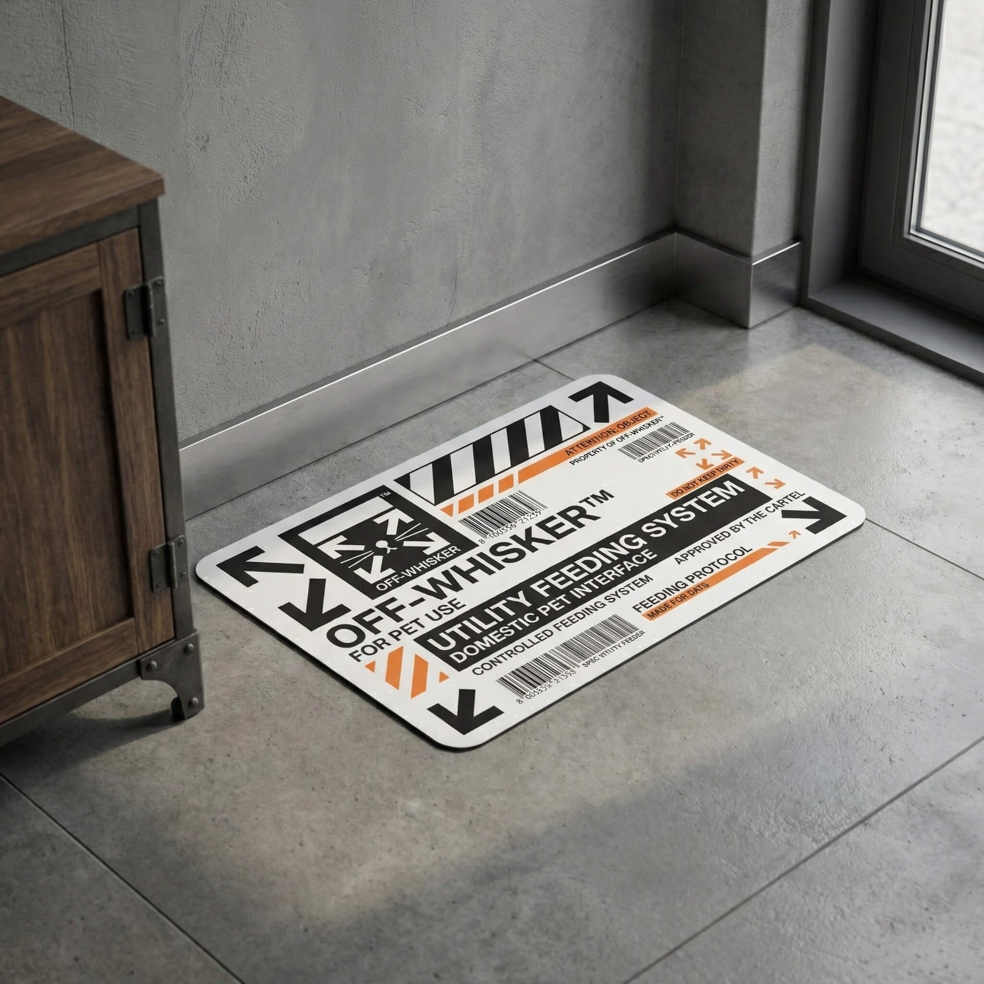 Off Whisker Utility Feeding System cat food mat on concrete floor by Mad Cat Cartel