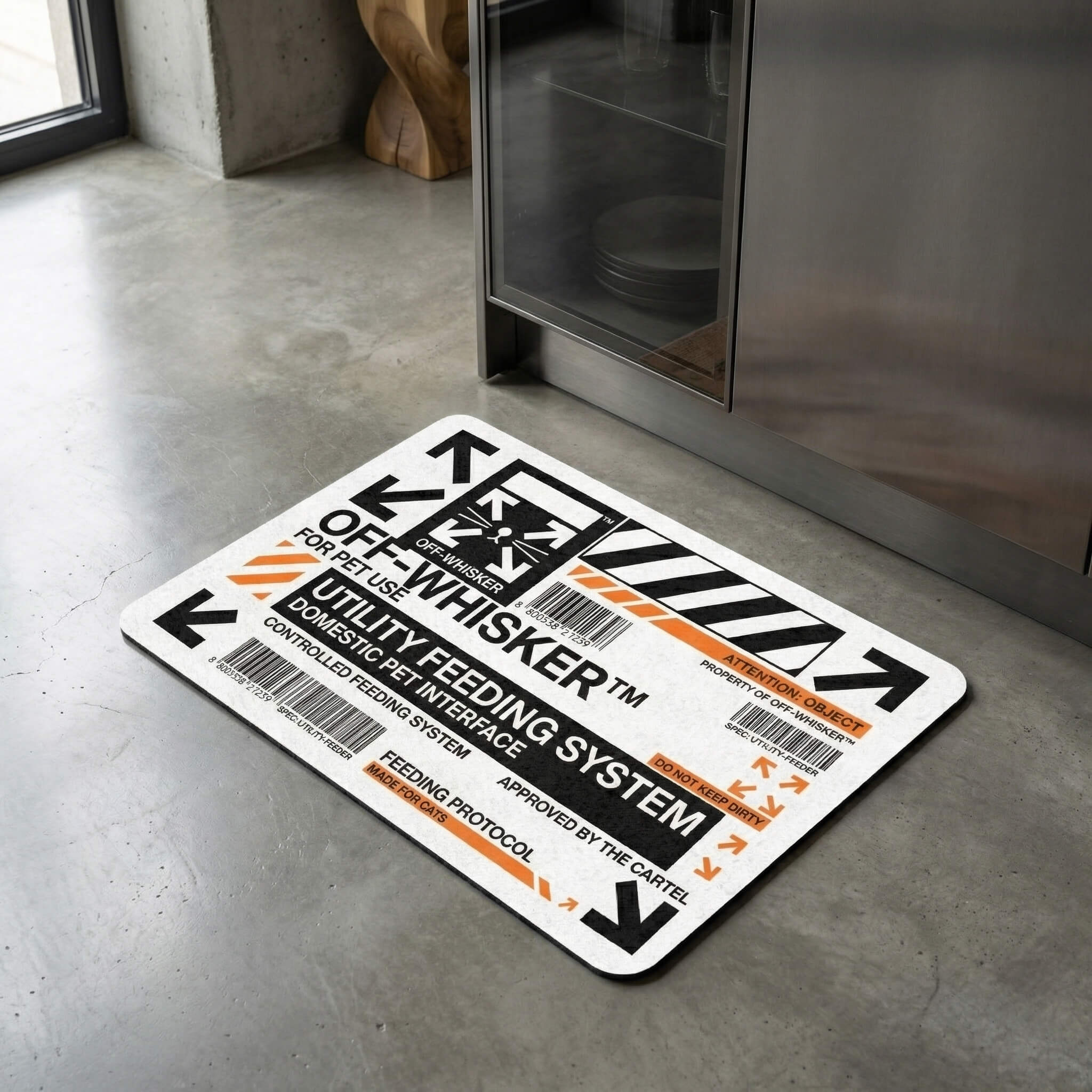 Off Whisker pet feeding mat on floor with utility graphic design by Mad Cat Cartel