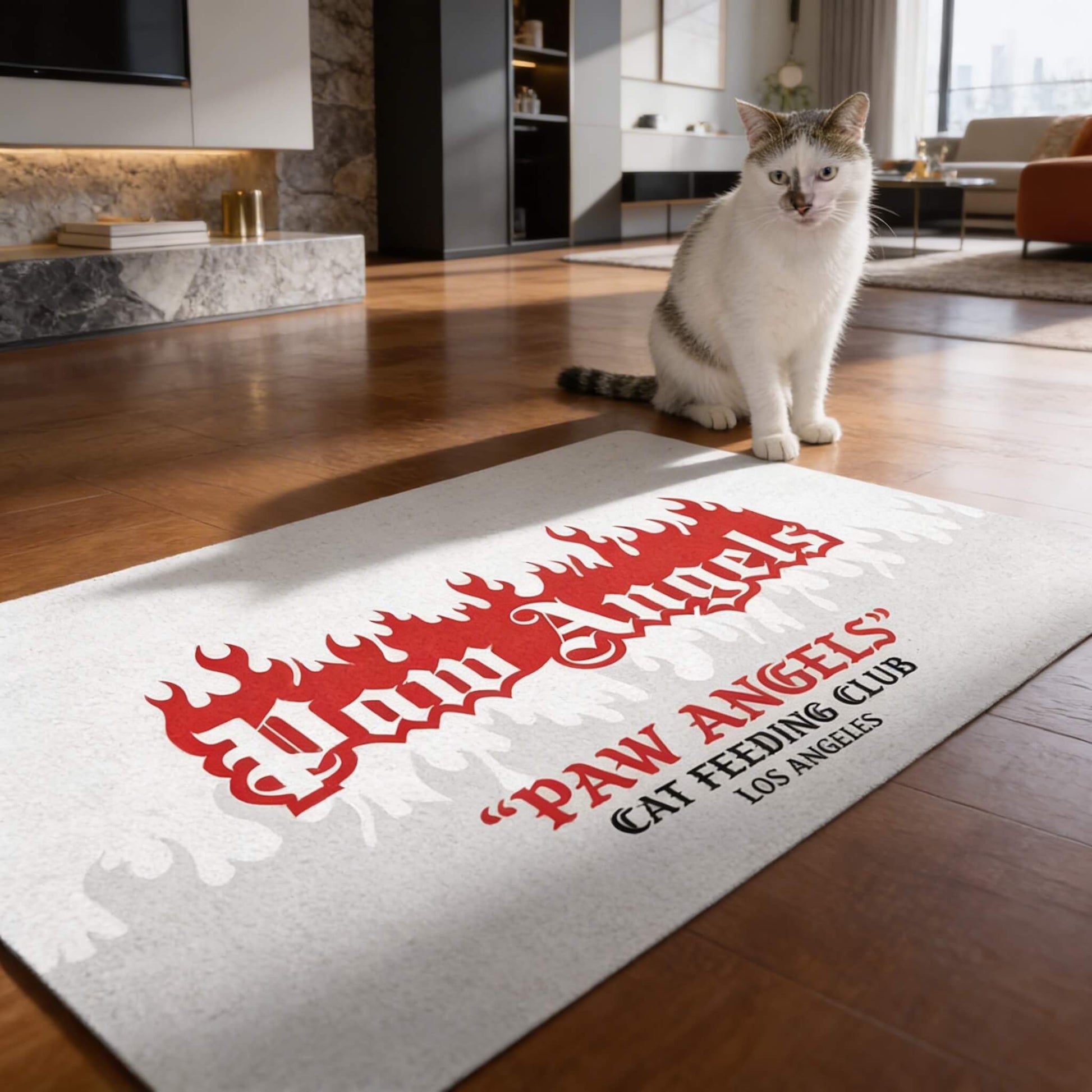 White cat food mat with Paw Angels flame lettering and seated cat by Mad Cat Cartel