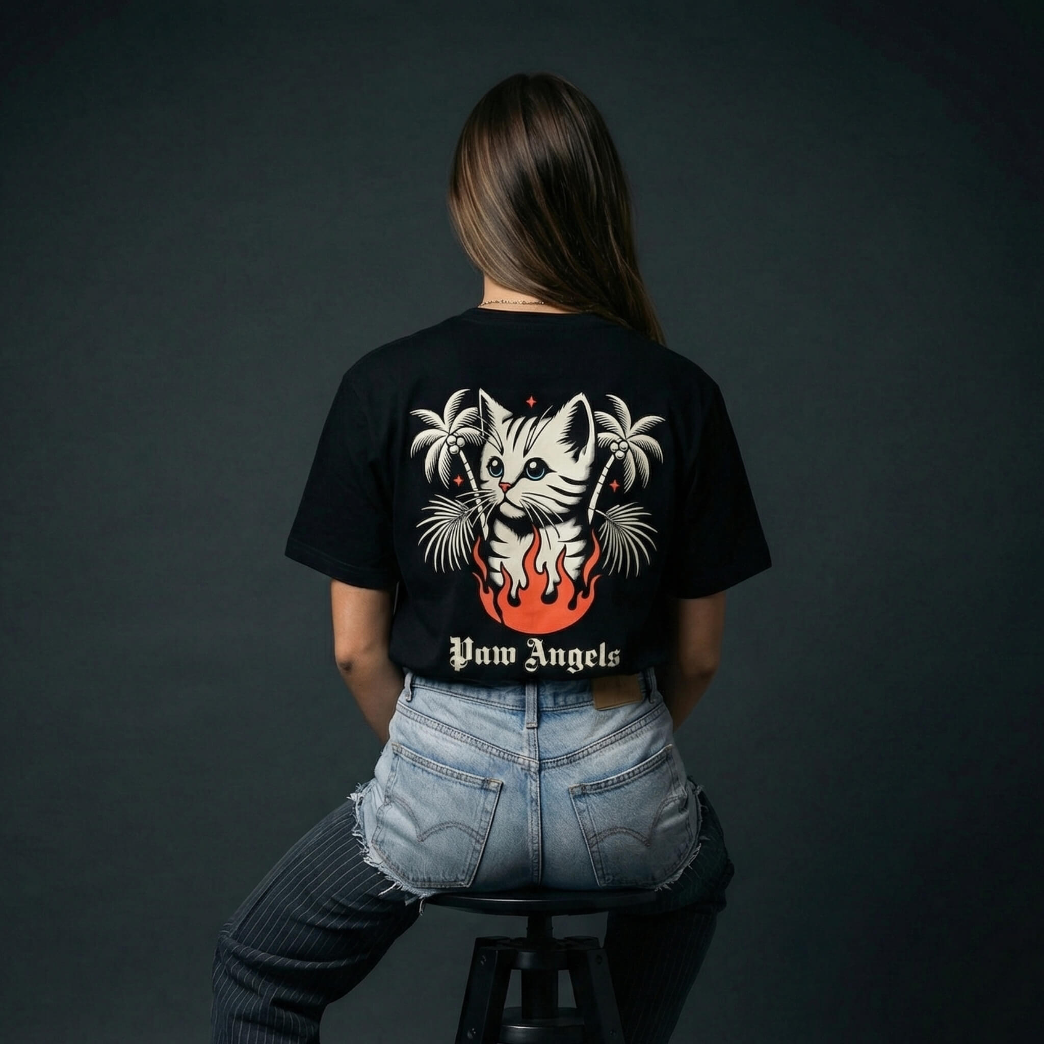 Paw Angels tropical flame cat t shirt by Mad Cat Cartel in black with large back print worn by woman model