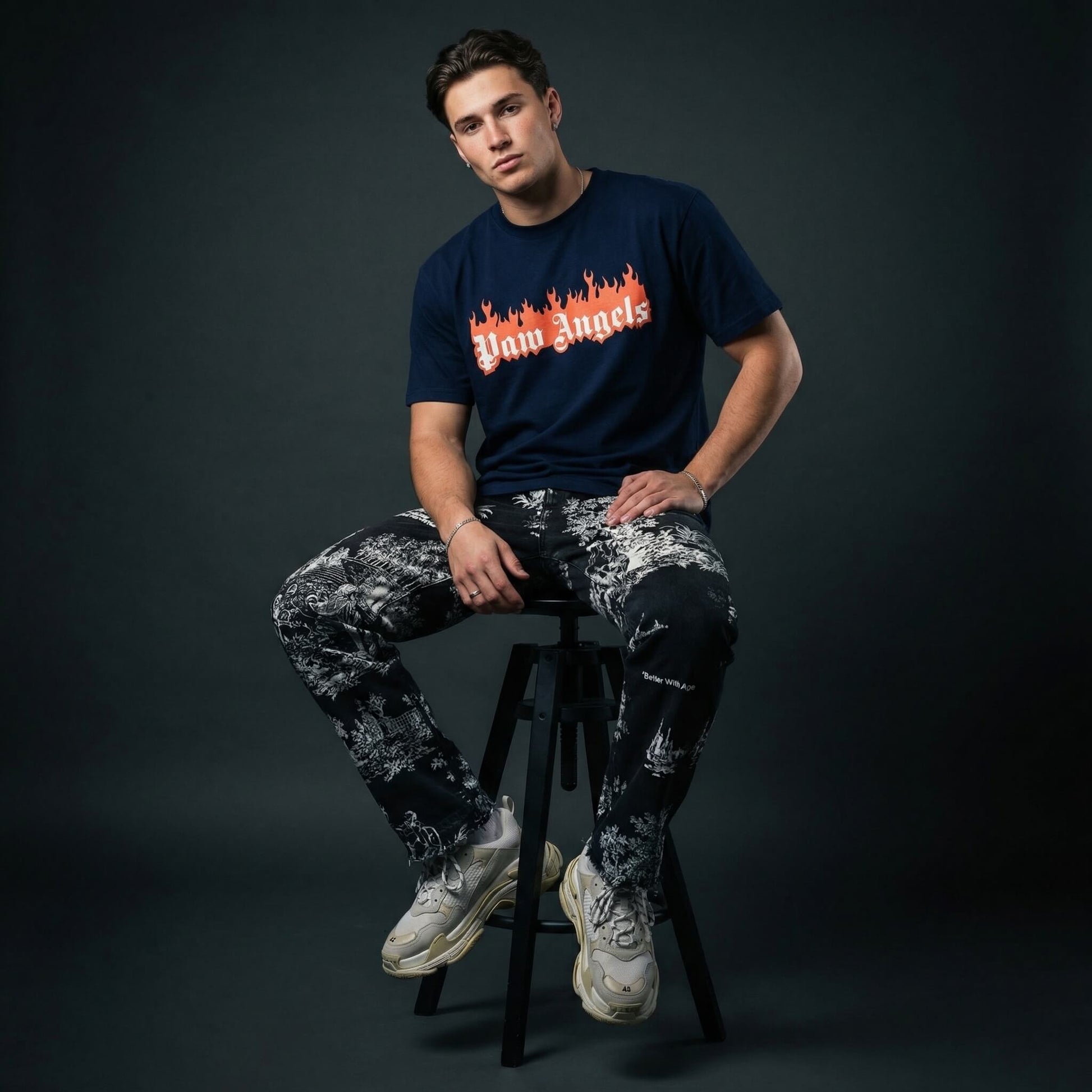 Paw Angels flame logo t shirt by Mad Cat Cartel in navy with front print worn by man model