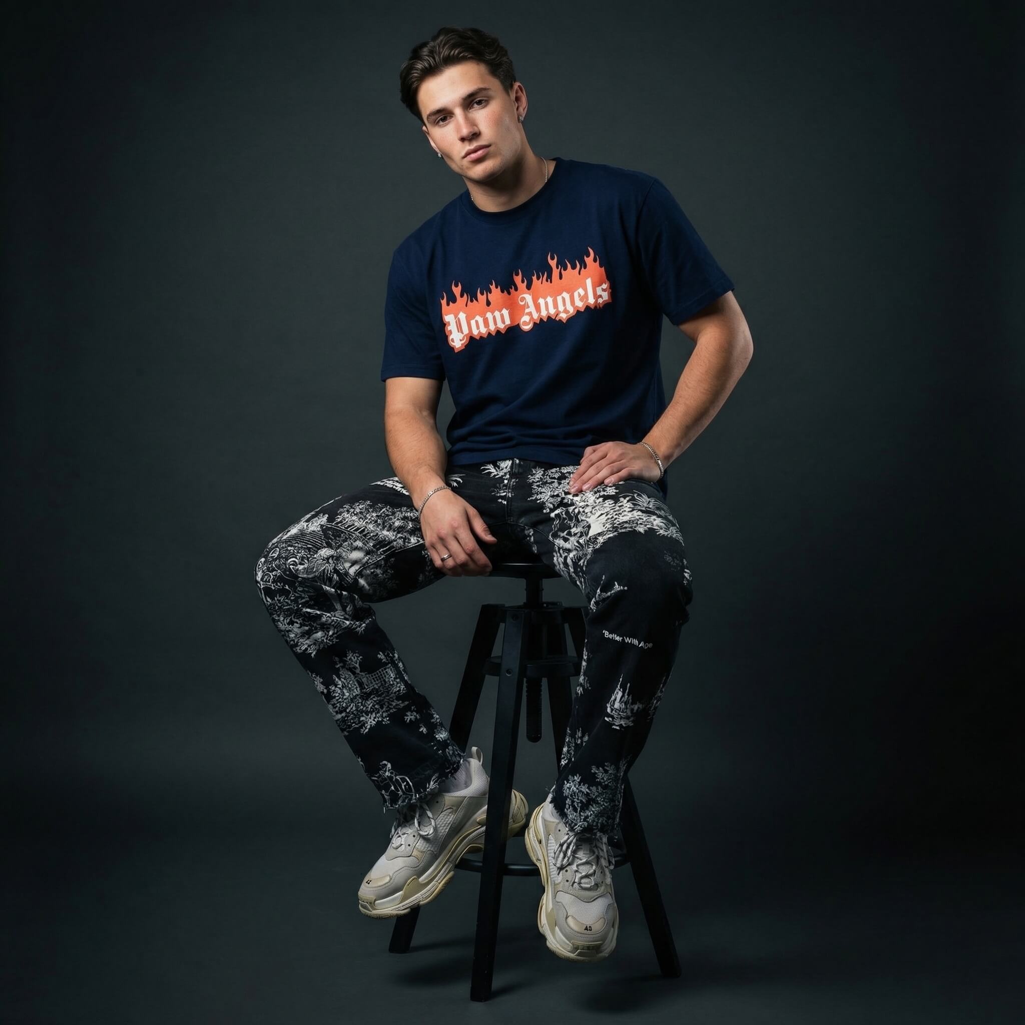 Paw Angels flame logo t shirt by Mad Cat Cartel in navy with front print worn by man model