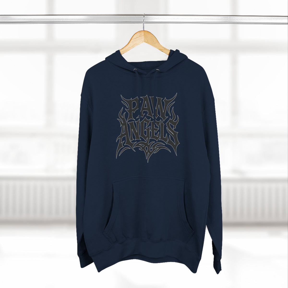 Paw Angels Tribal Logo Graphic Hoodie in navy, on a hanger