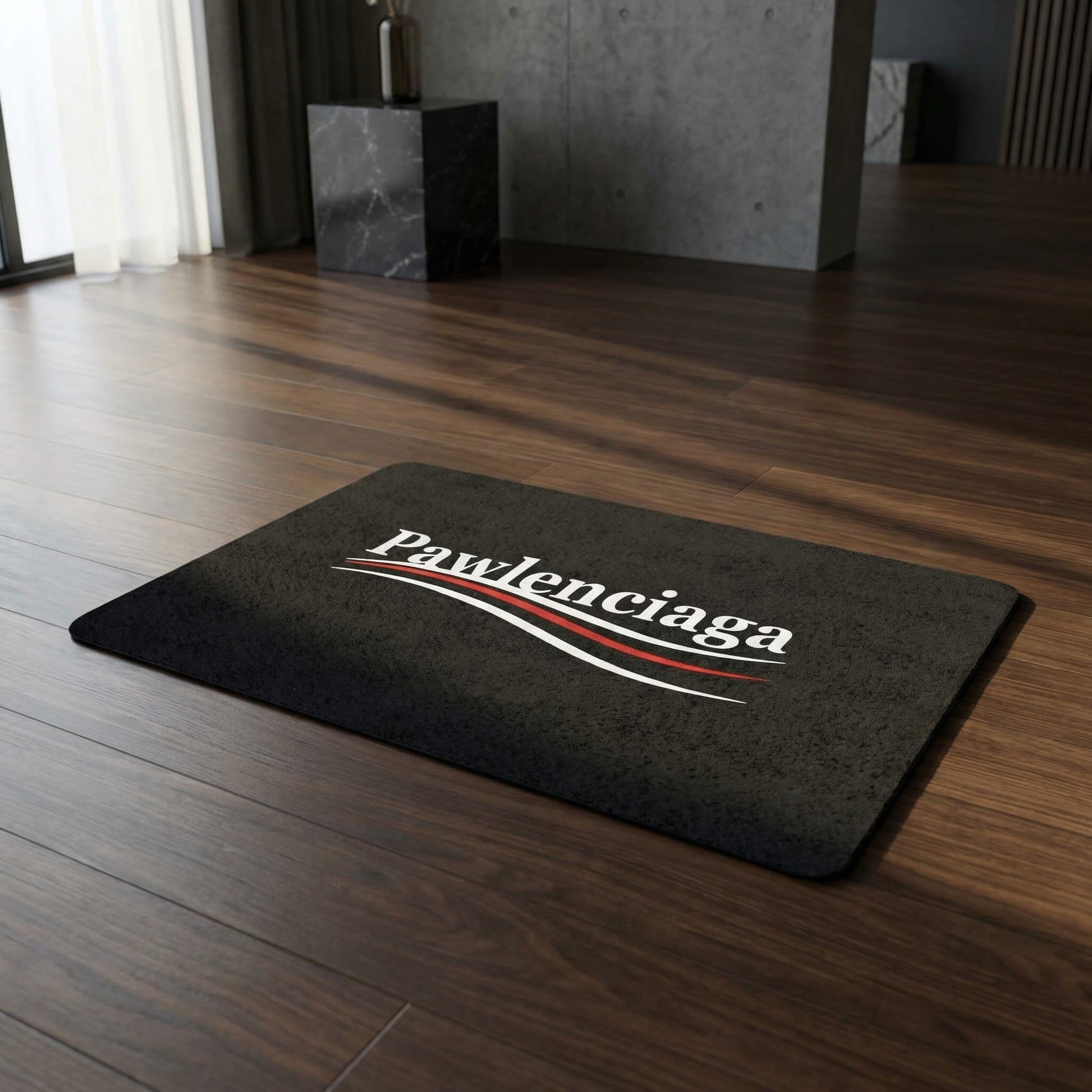 Pawlenciaga black pet food mat on wood floor designer feeding mat by Mad Cat Cartel