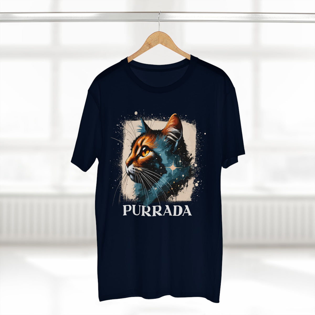 Purrada Cosmic Gaze Cat Graphic Designer T-Shirt in navy, on a hanger