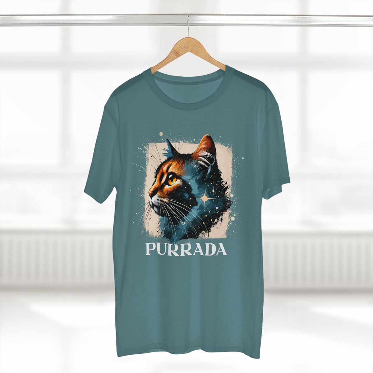 Purrada Cosmic Gaze Cat Graphic Designer T-Shirt in slate blue, on a hanger