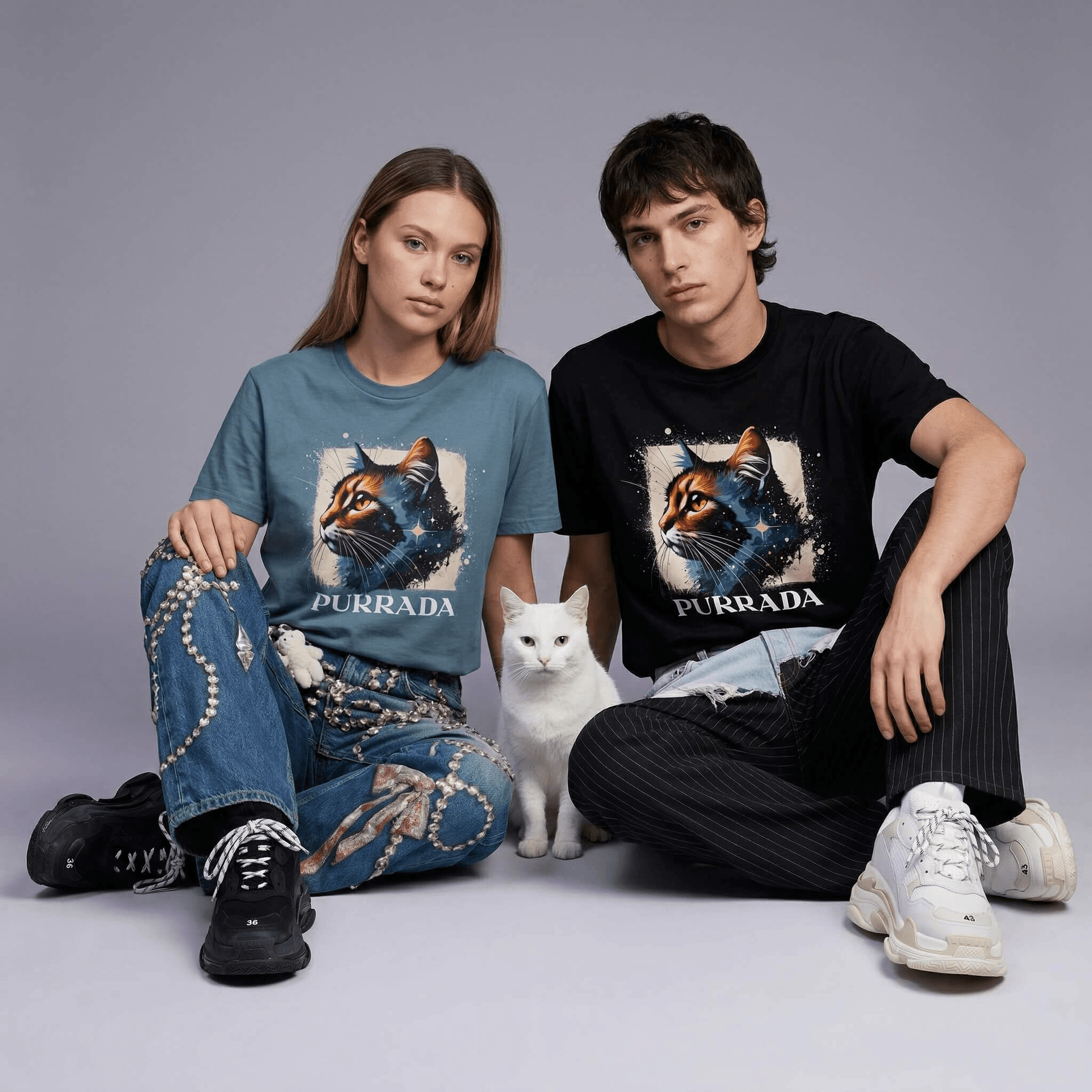 Purrada Cosmic Gaze cat lover t shirts by Mad Cat Cartel worn by woman and man models in slate blue and black with white cat