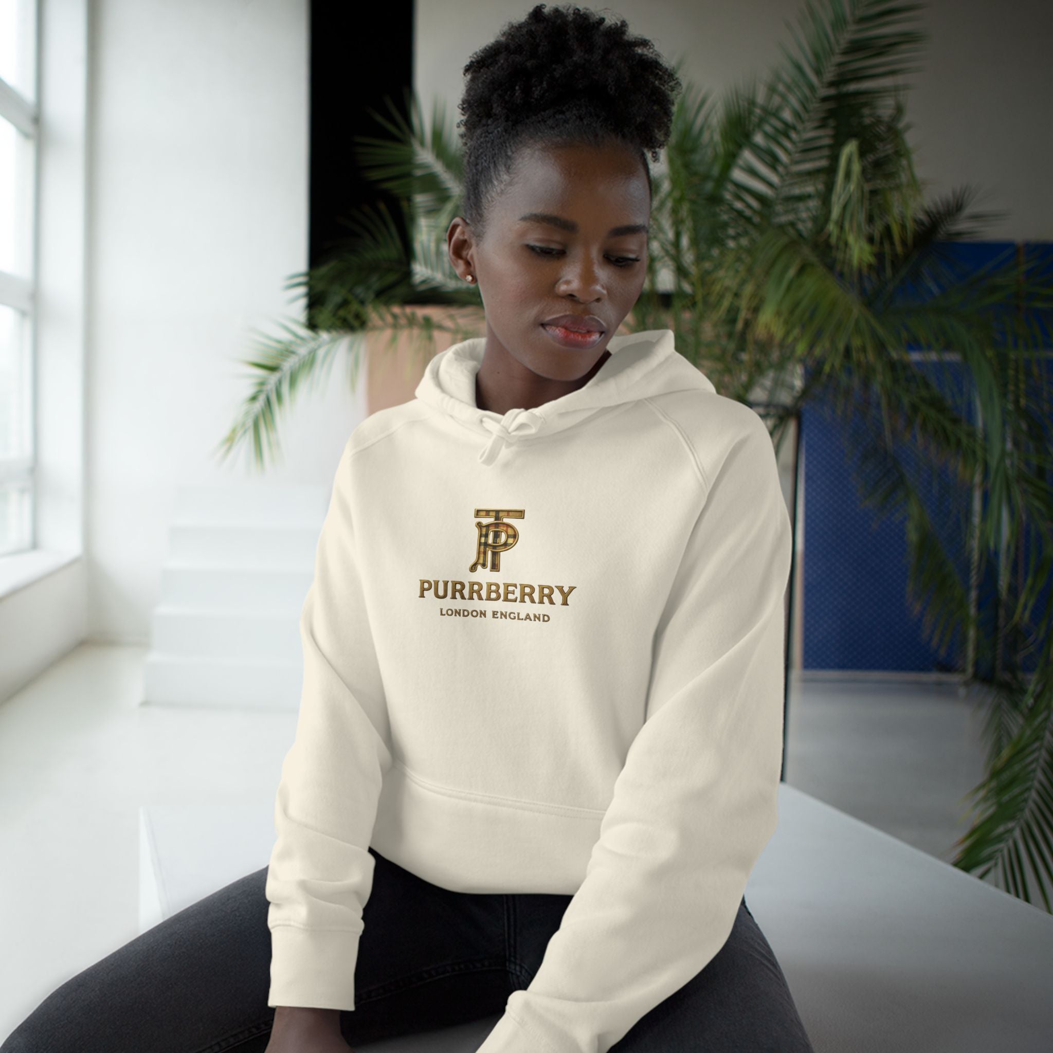 Purrberry Chest Logo Steampunk Couture Cat Graphic Hoodie in ecru, worn by a female model