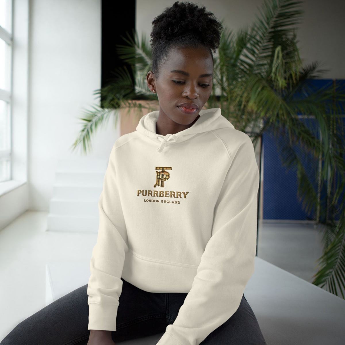 Purrberry Chest Logo Steampunk Couture Cat Graphic Hoodie in ecru, worn by a female model