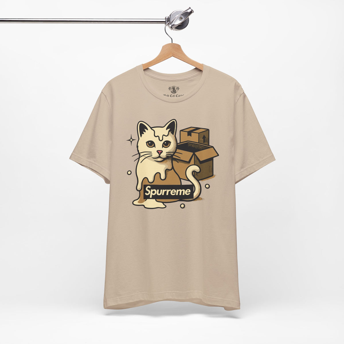 Spurreme Box Addict Cat Graphic T-Shirt in tan, on a hanger