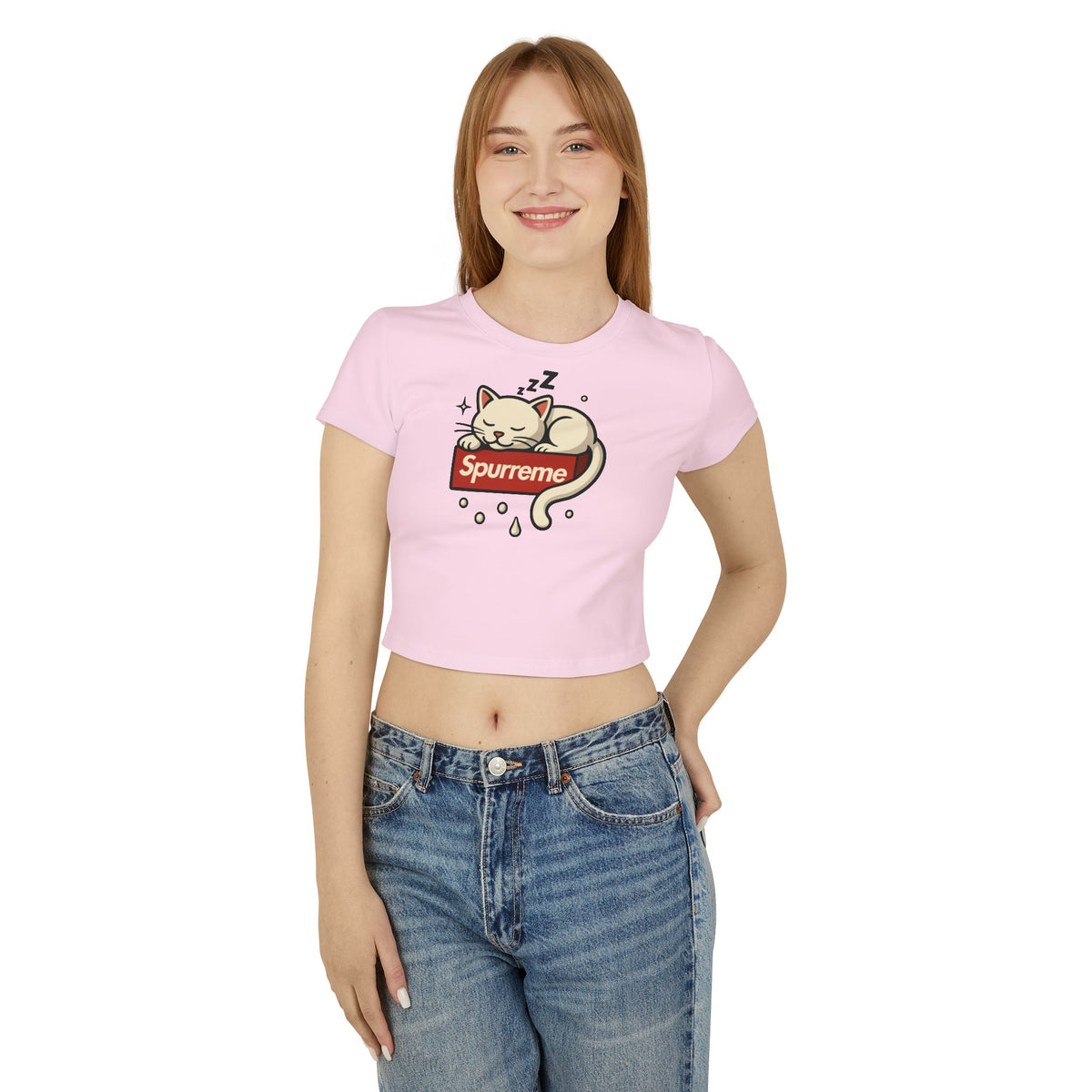 Spurreme Box Logo Dreaming Cat Graphic Women's Baby Tee in light pink, worn by a female model