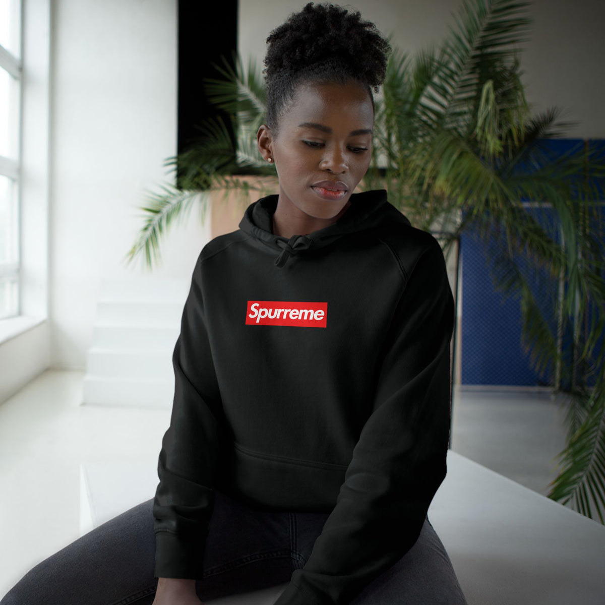 Spurreme Box Logo Parody Hoodie in black, worn by a female model