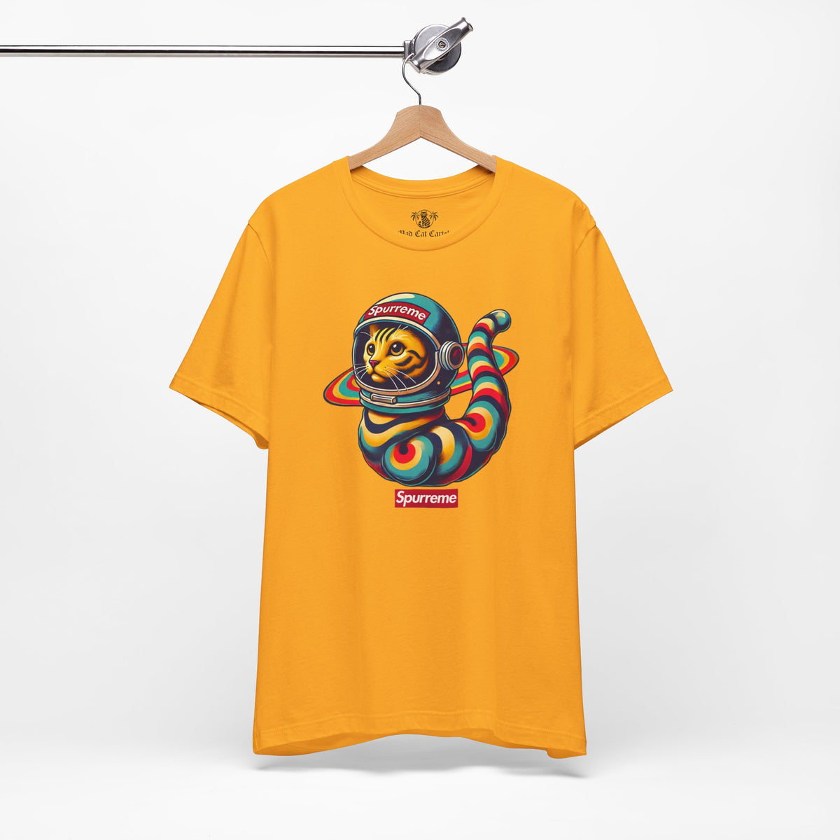 Spurreme Space Explorer Cat Graphic T-Shirt in gold, on a hanger
