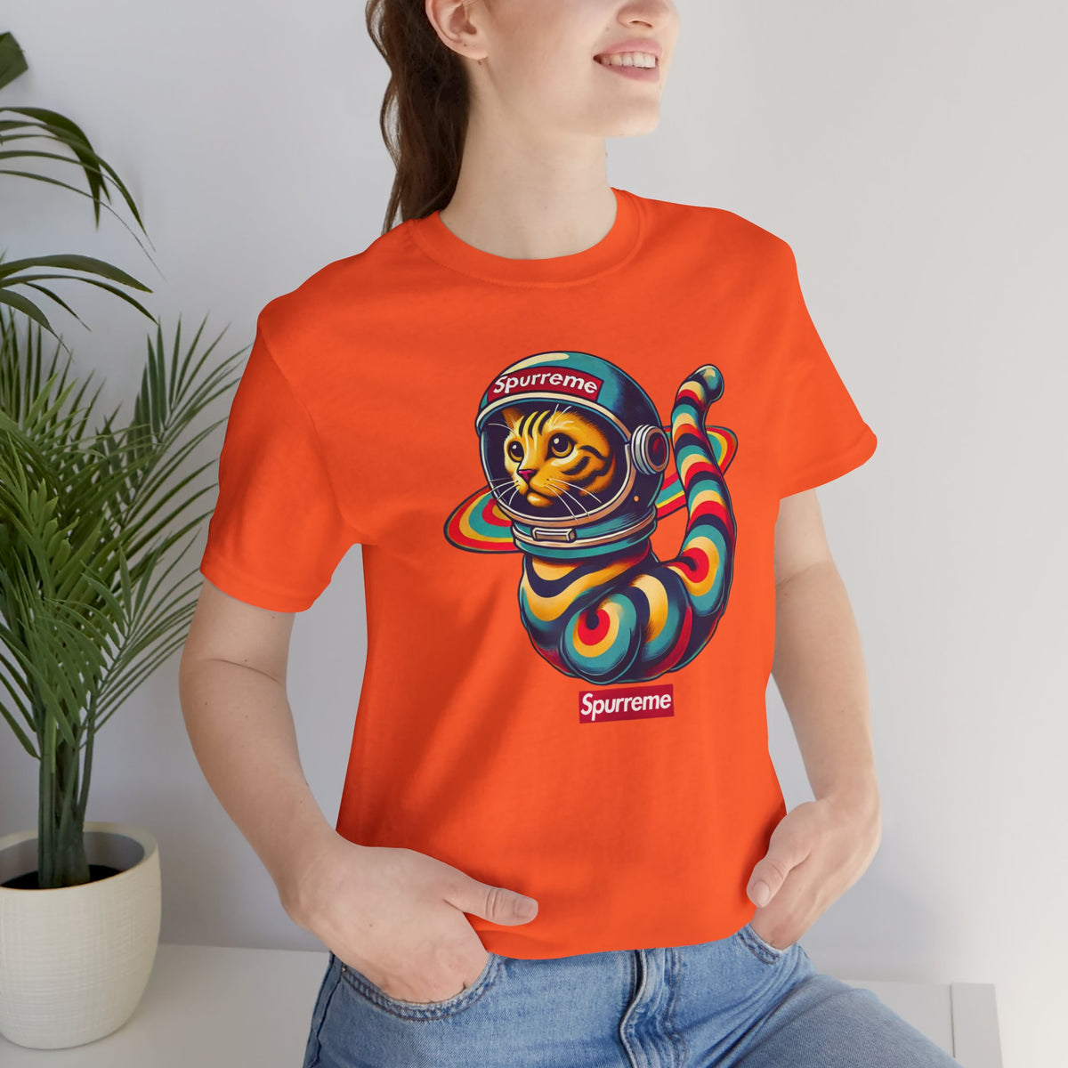 Spurreme Space Explorer Cat Graphic T-Shirt in orange, worn by a female model