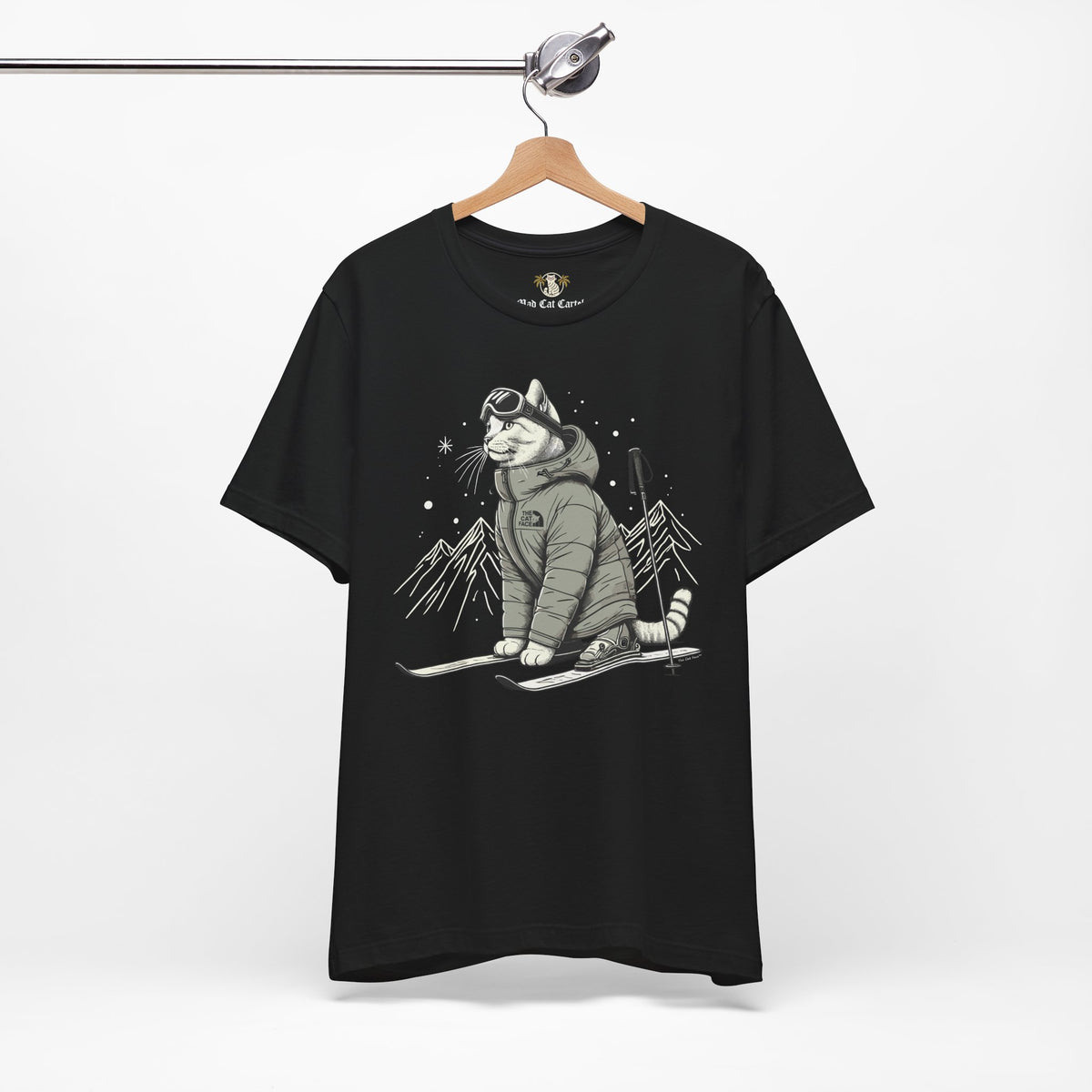The Cat Face Alpine Explorer Graphic T-Shirt in black, on a hanger