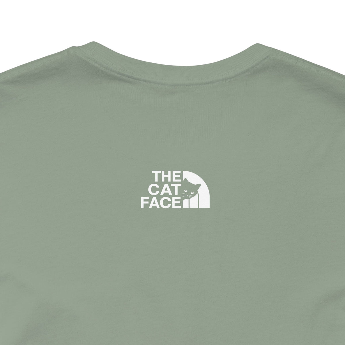 The Cat Face Alpine Explorer Graphic T-Shirt in sage, close-up of the back print