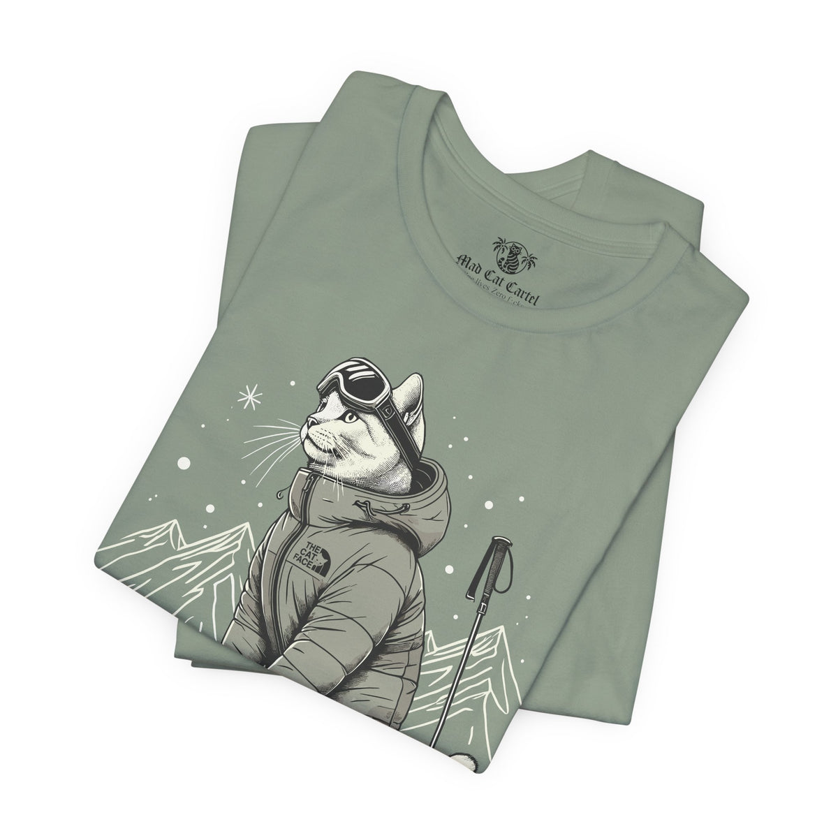 The Cat Face Alpine Explorer Graphic T-Shirt in sage, folded