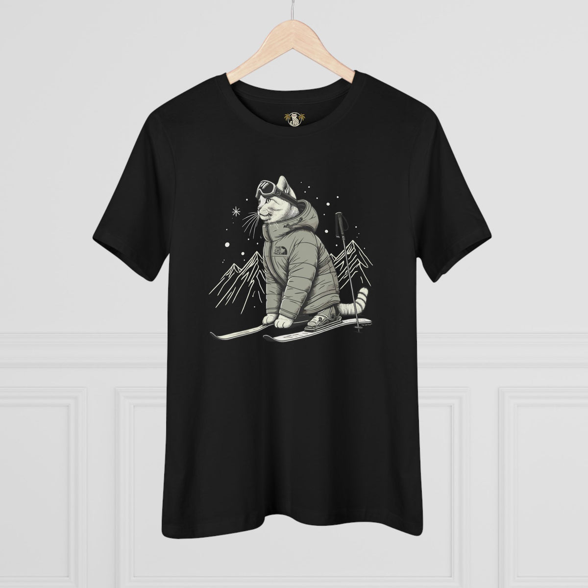The Cat Face Alpine Explorer Graphic Women's T-Shirt in black, on a hanger