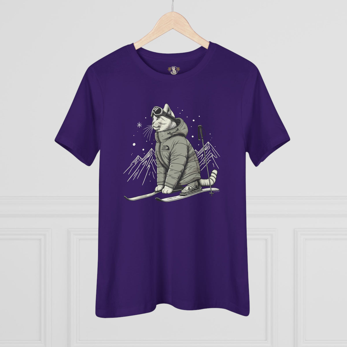 The Cat Face Alpine Explorer Graphic Women's T-Shirt in team purple, flat lay