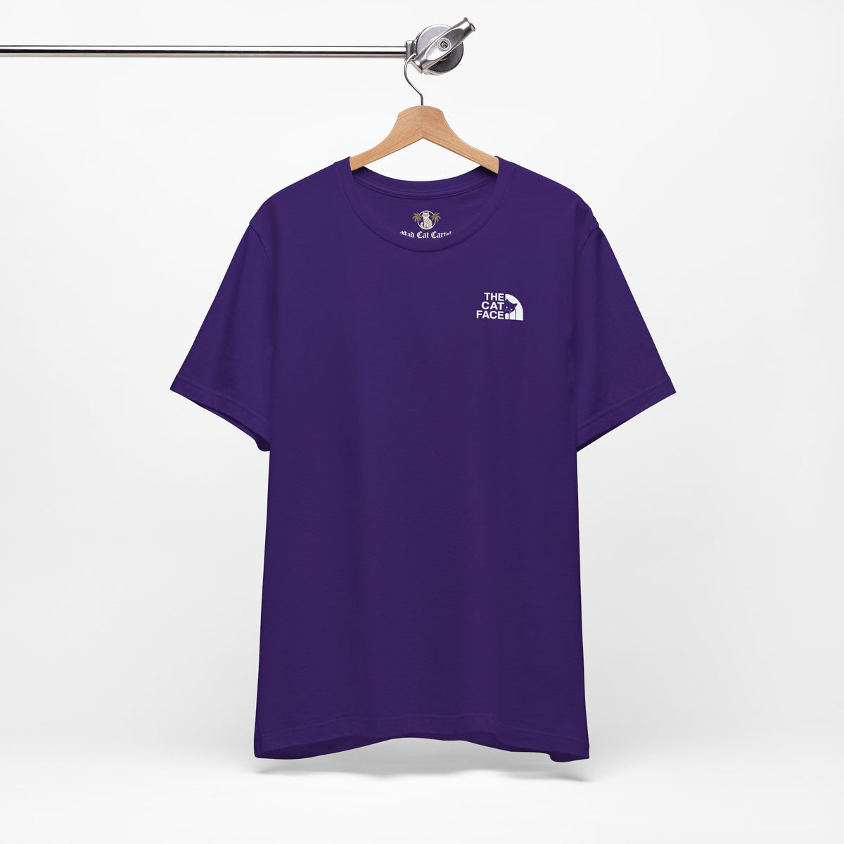 The Cat Face Classic Mini Chest Logo T-Shirt in team purple, on a hanger