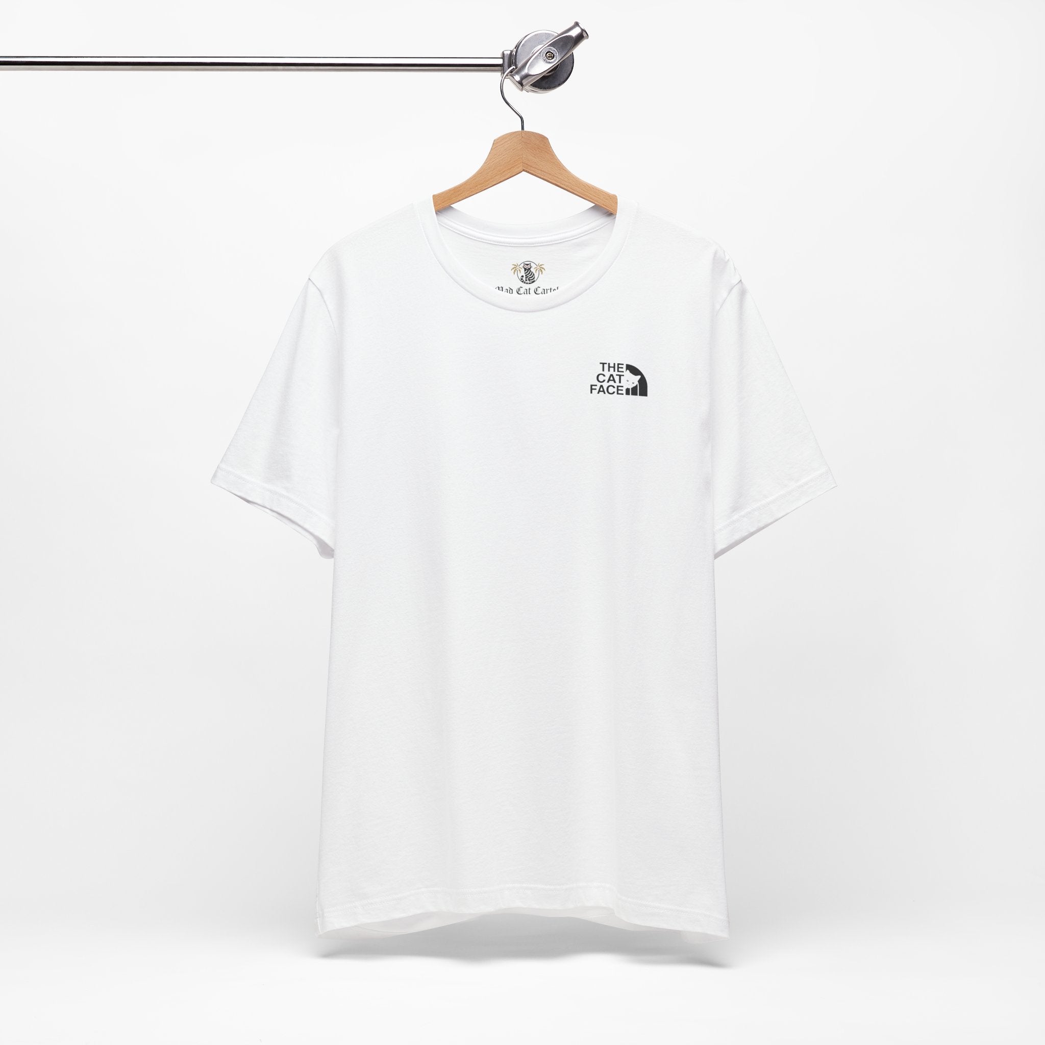 The Cat Face Classic Mini Chest Logo T-Shirt in white, on a hanger