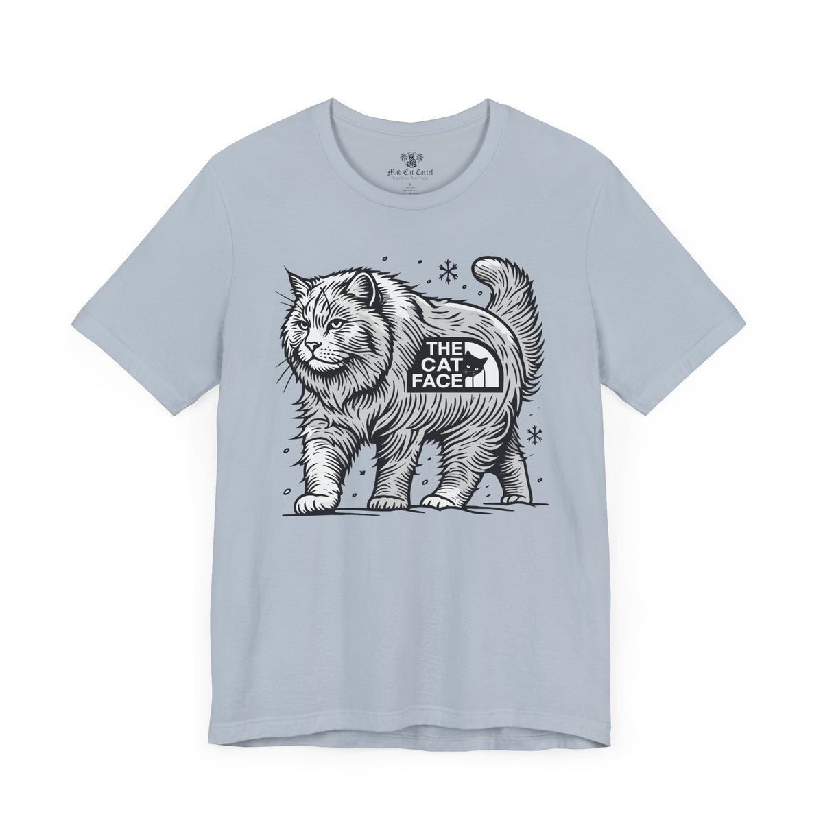 The Cat Face Snow Explorer Cat Graphic T-Shirt in light blue, flat lay