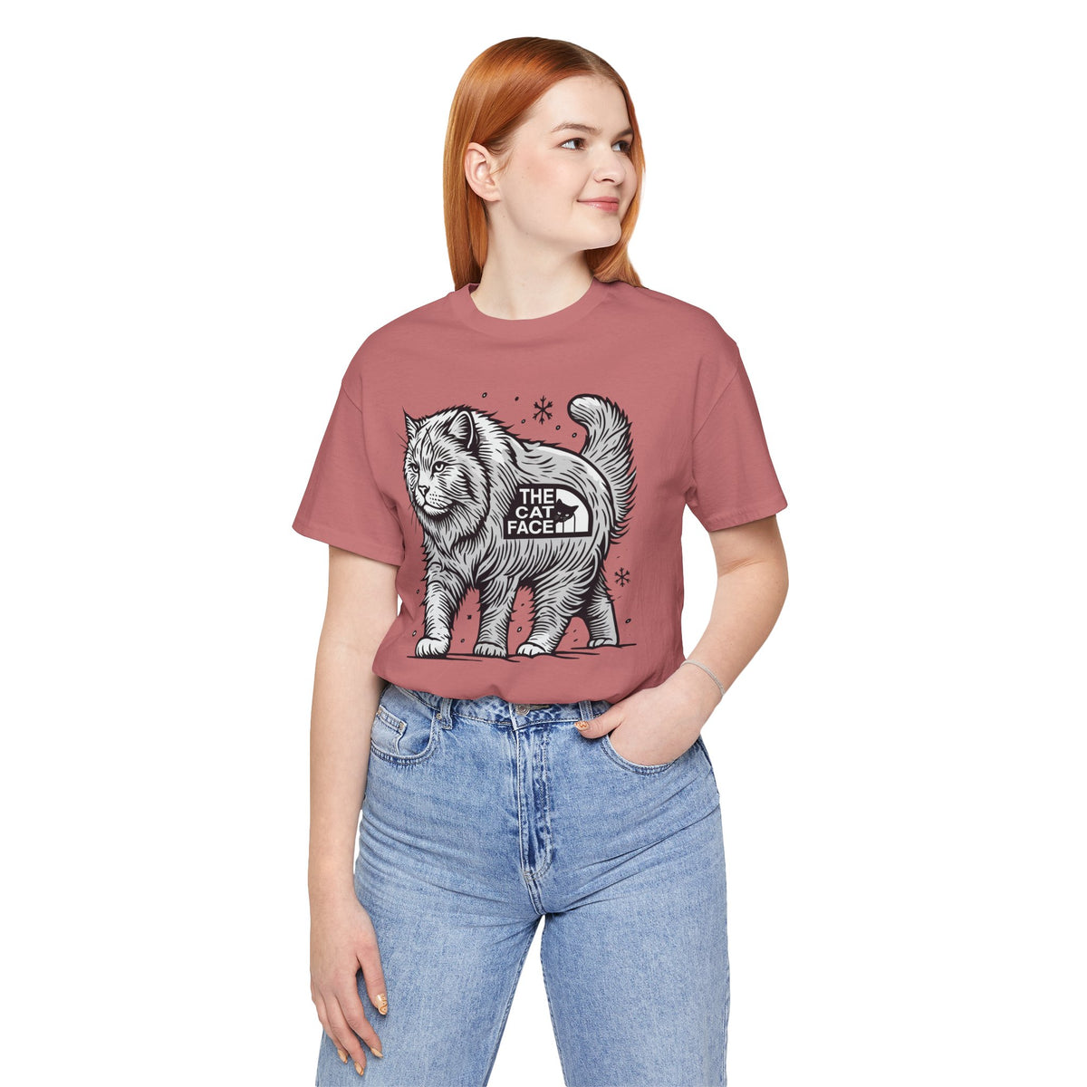 The Cat Face Snow Explorer Cat Graphic T-Shirt in mauve, worn by a female model
