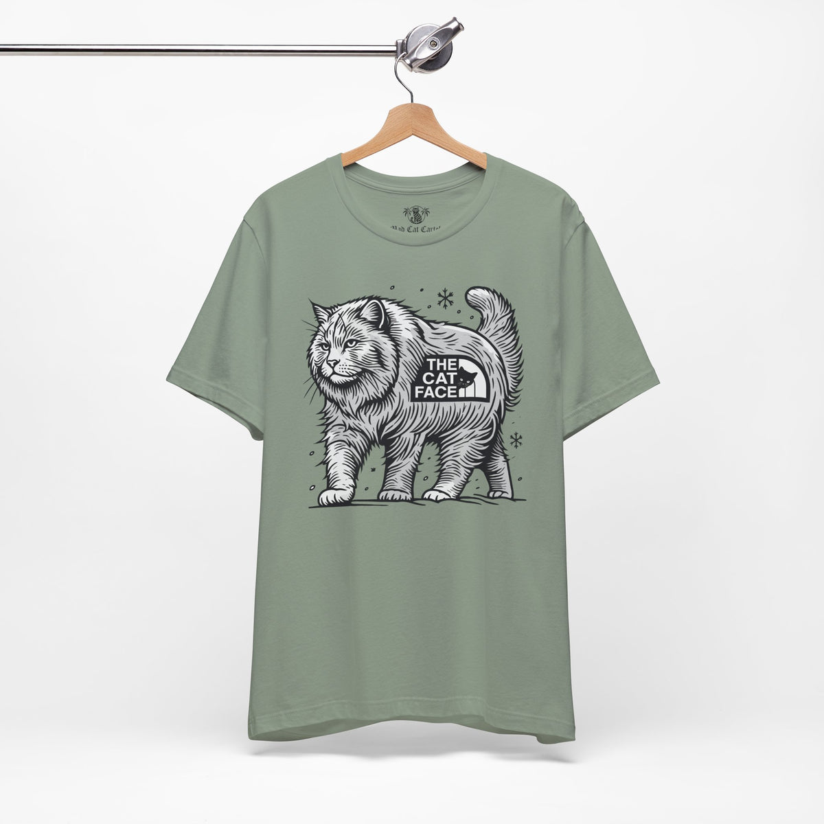 The Cat Face Snow Explorer Cat Graphic T-Shirt in sage, front view