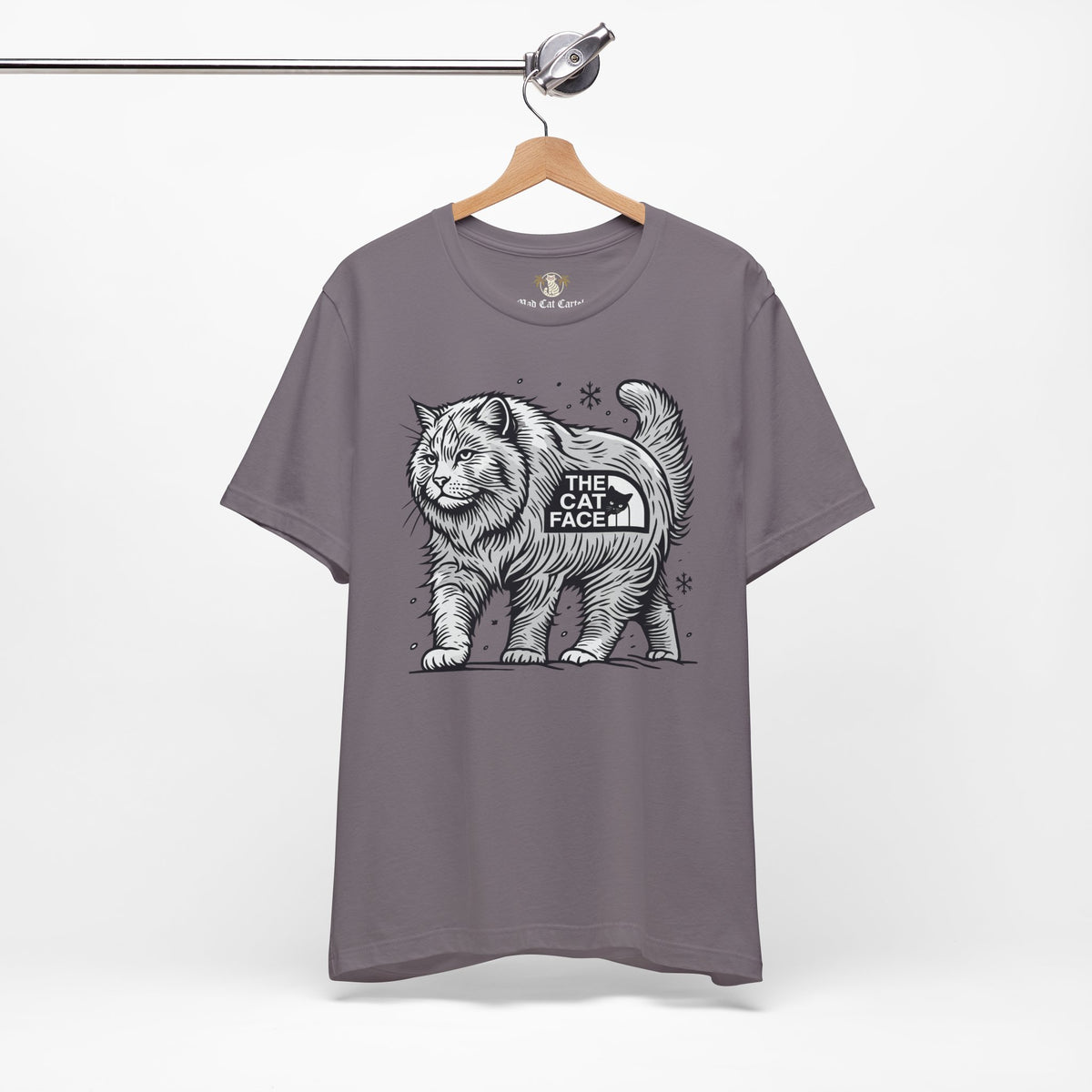 The Cat Face Snow Explorer Cat Graphic T-Shirt in storm, on a hanger