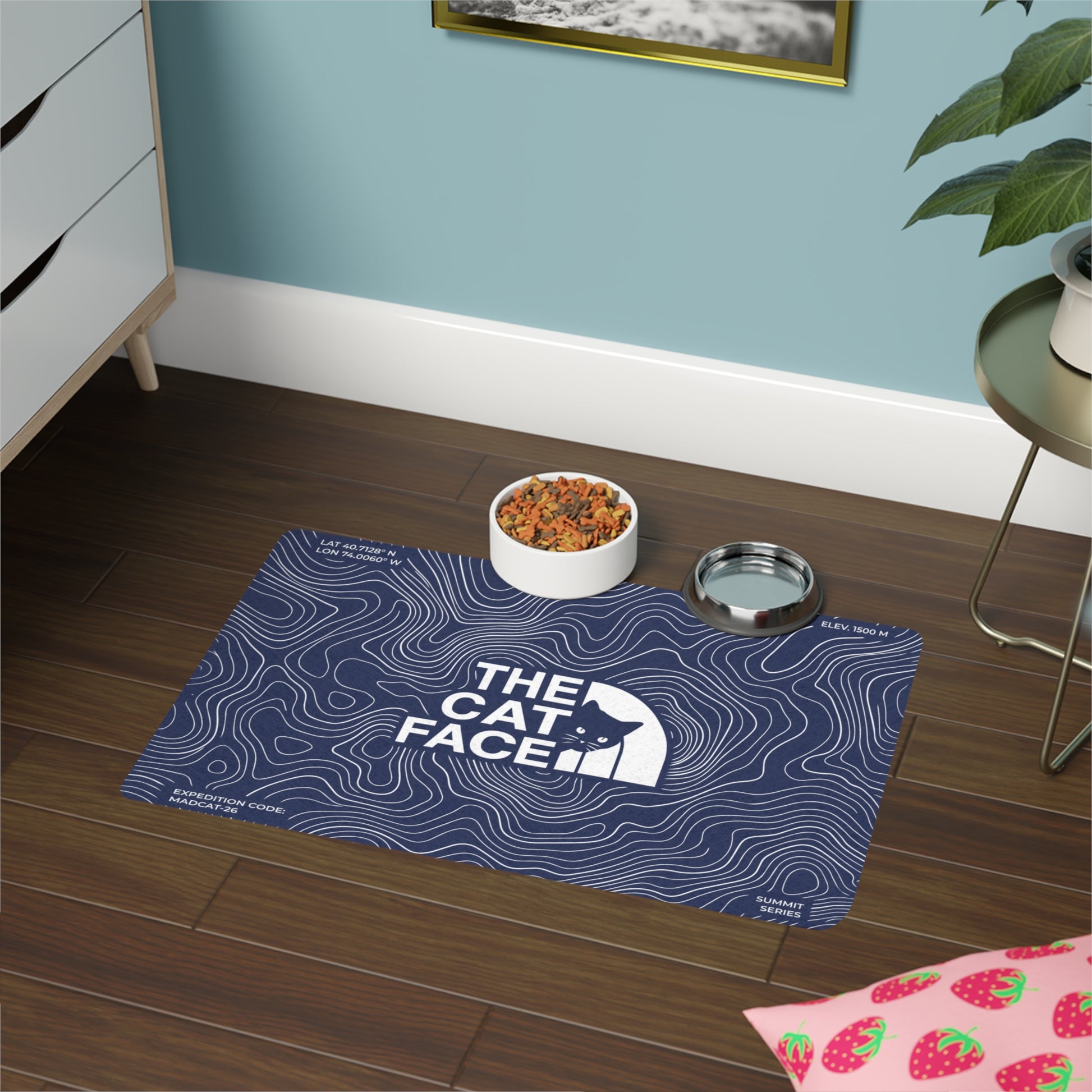 Designer cat mealtime mat with The Cat Face logo and blue expedition line pattern