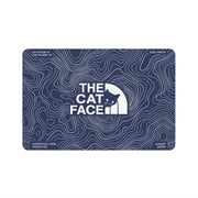 The Cat Face Summit Terrain blue cat feeding mat with white topo lines by Mad Cat Cartel