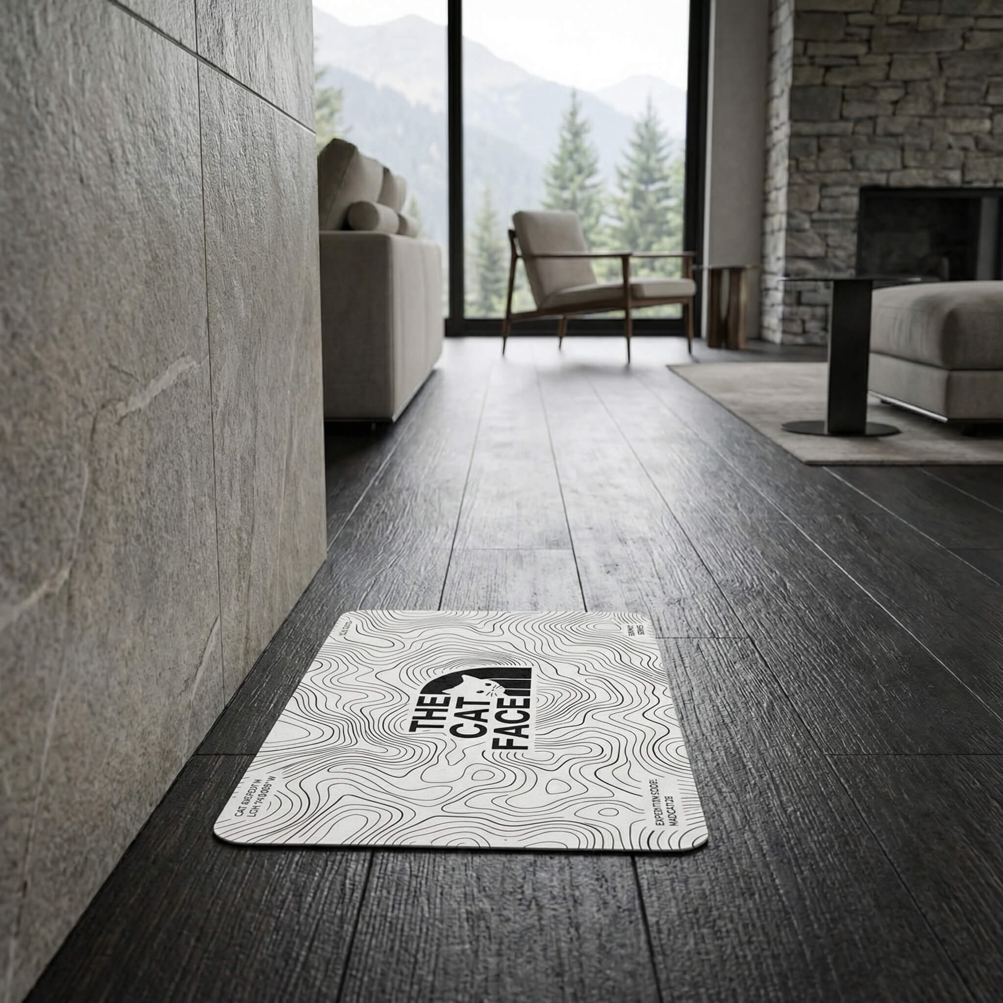 The Cat Face cat feeding mat on dark floor white topo line mat by Mad Cat Cartel