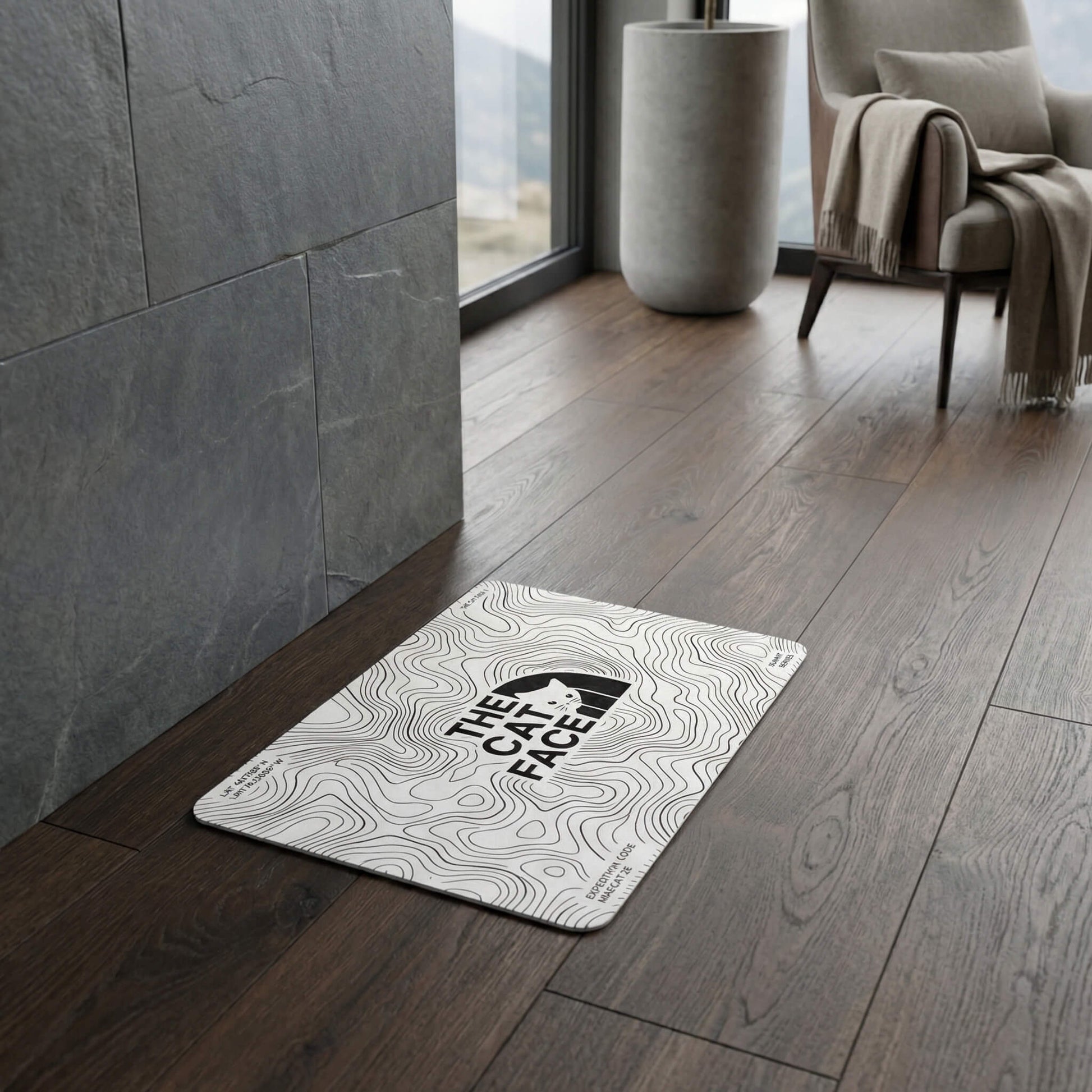 The Cat Face Summit Terrain white cat bowl mat on wood floor by Mad Cat Cartel