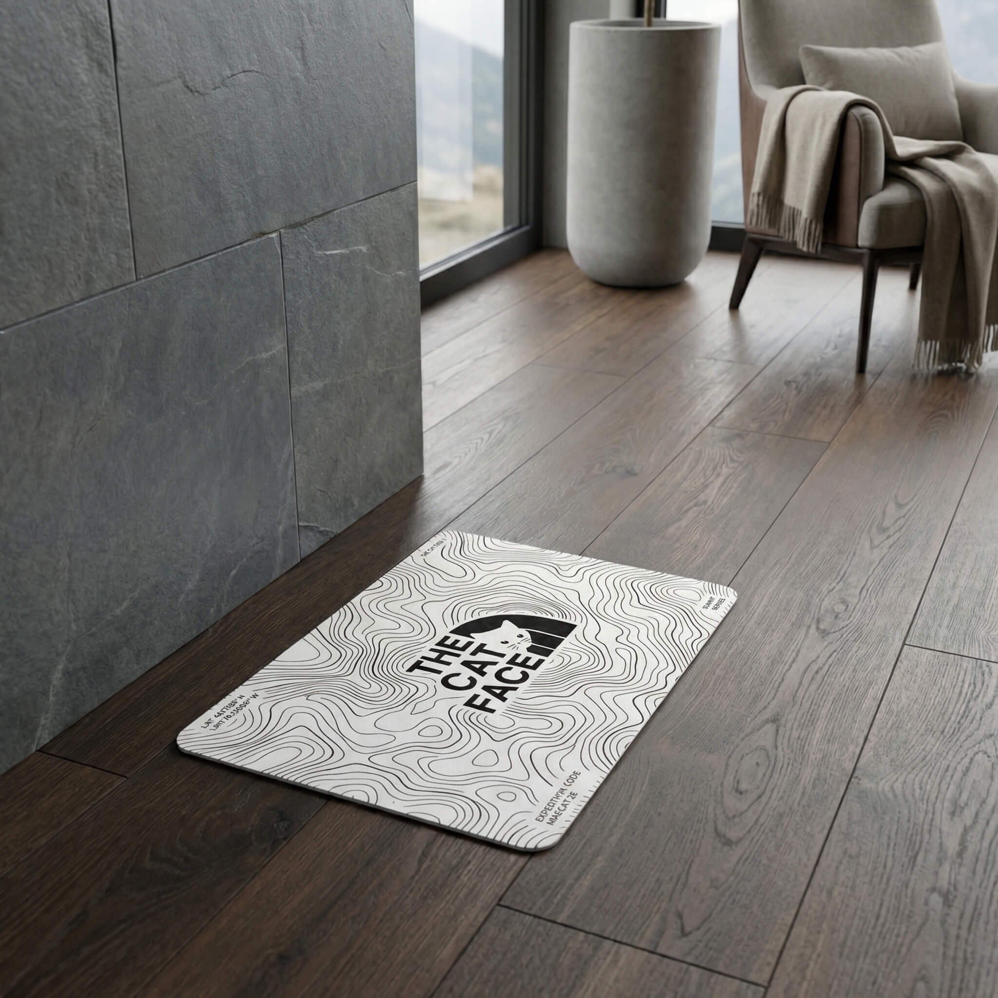 The Cat Face Summit Terrain white cat bowl mat on wood floor by Mad Cat Cartel