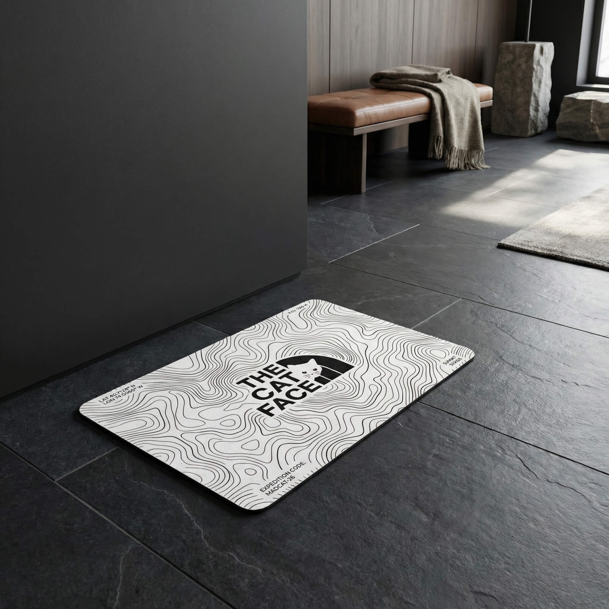 The Cat Face cat bowl mat white feeding mat in dark interior by Mad Cat Cartel