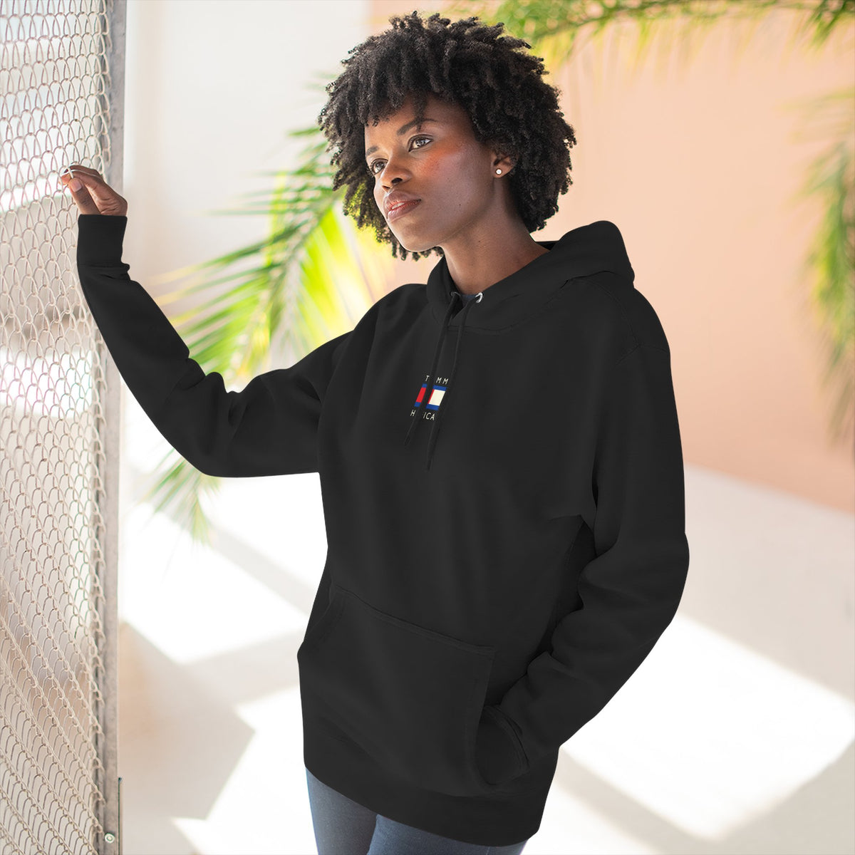 Tommy Hilficat Chest Logo Colorwave Cat Graphic Hoodie in black, worn by a male model