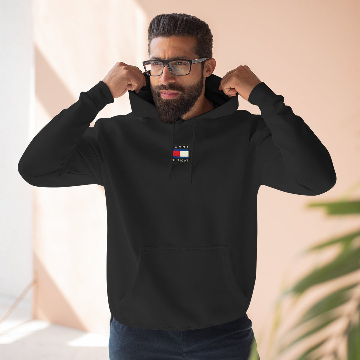 Tommy Hilficat Chest Logo Colorwave Cat Graphic Hoodie in black, worn by a male model