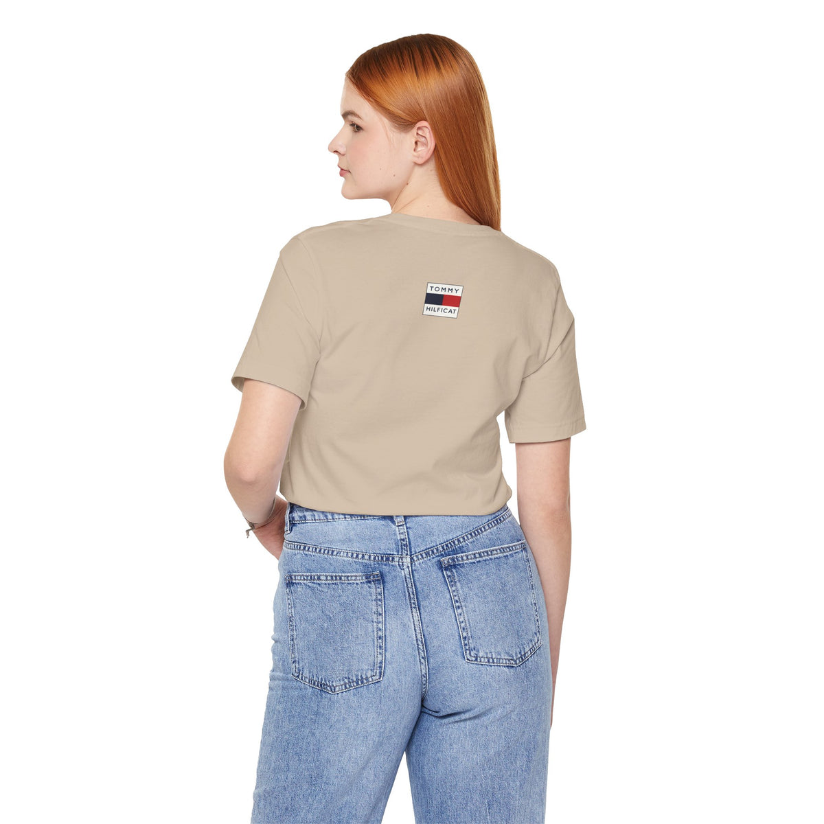 Tommy Hilficat Regal Outline Cat Graphic T-Shirt in tan, back view on a female model